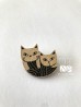 Broche chats entrelacés